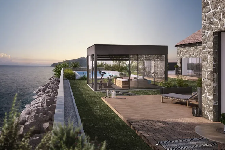 Véranda contemporaine à toiture plate sur une terrasse en bord de mer